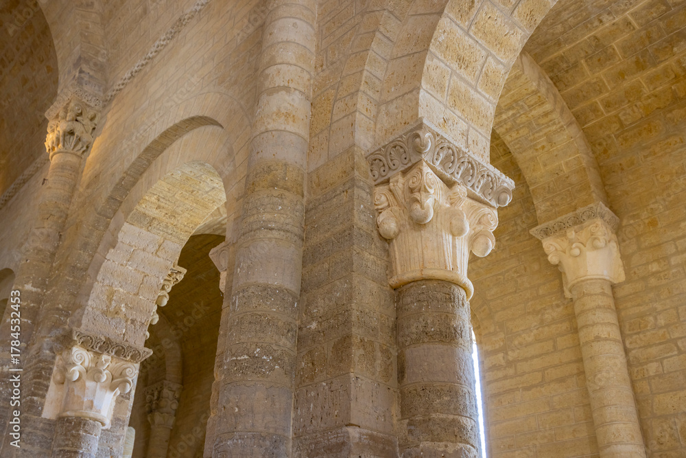 Obraz premium Romanesque architecture detail, pillars and arches in San Martin Church