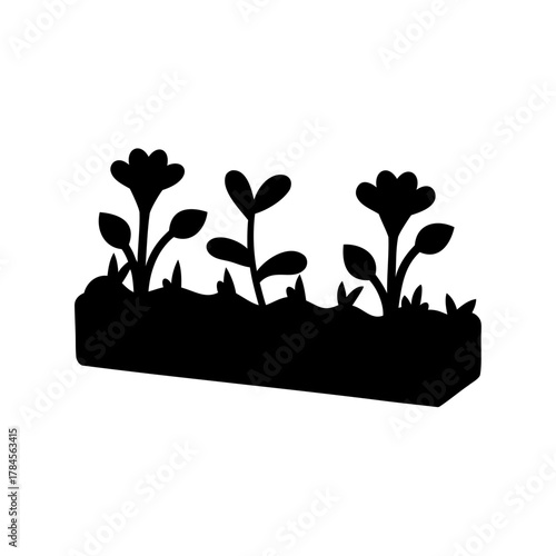 Black silhouette of plants and flowers growing in a rectangular box