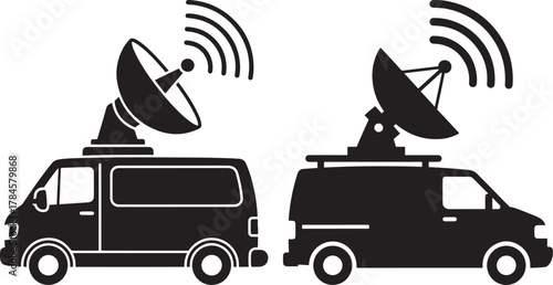 Two satellite news vans broadcasting signals silhouette