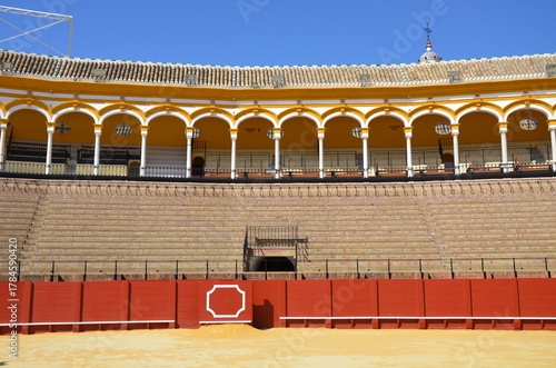 Seville, Spain 03.25.2019: Golden groomed sand and empty stands at the Seville bullfighting ring