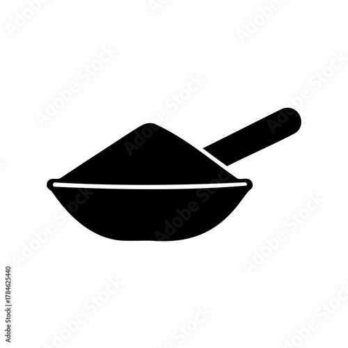 Black scoop filled with fine powder, offering a simple monochrome aesthetic