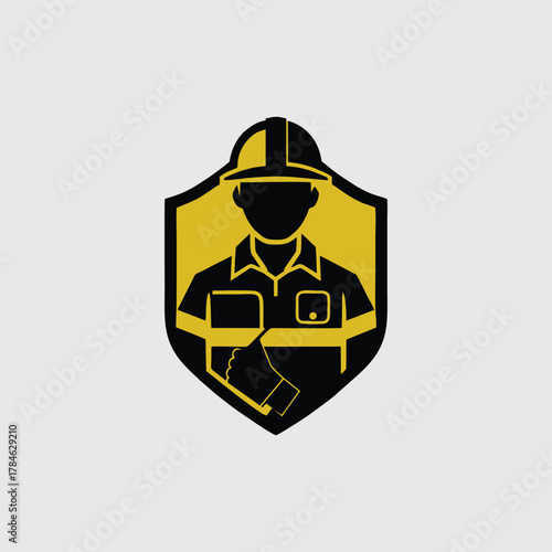 Graphic icon of an industrial worker in a safety helmet within a protective shield emblem, symbolizing protection and labor.