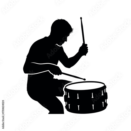 Silhouette of a musician playing the drums.