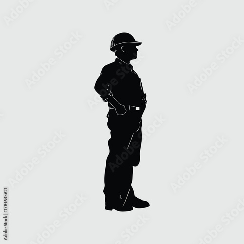 Silhouette of a construction worker or engineer wearing a hard hat, standing in profile with hands on hips.