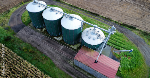 Agricultural silos storing grain, concept of farming, food production, and sustainable rural industry development