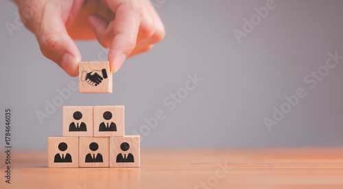 Empathy and teamwork in the workplace building trust and collaboration among employees with wooden blocks representing emotional intelligence and diversity