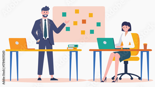 A man in a suit presents ideas on a whiteboard to a woman working on a laptop at her desk in a modern office setting