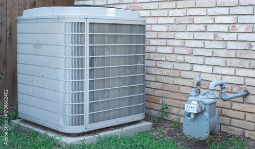 Cuadro en lienzo Panorama view house side yard with central AC condenser and natural gas meter wi