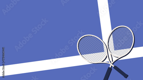 Two tennis rackets sit on a blue court with white lines before a match starts.