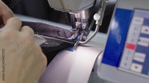 Industrial Sewing Machine in Action. Close-up Textile Factory Footage