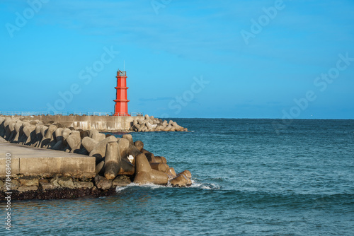 Red Lighthouse and Tetrapods at Naksan Beach Breakwater, South Korea