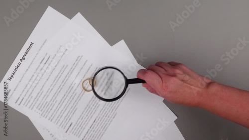 Marital Settlement Separation Agreement paper document on table, ready for signature, symbolizing wedding, divorce, prenuptial contract, breakup and separation.