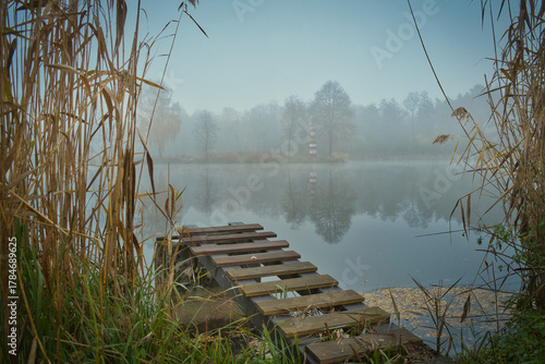 Fototapeta Naklejka Na Ścianę i Meble -  foggy morning in the lakein Tarka Jaworzno polish old holiday resort
