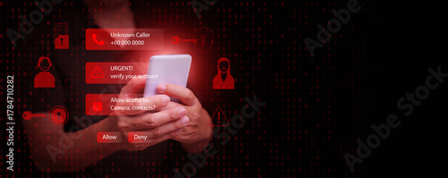 A man holding smartphone with hacking and phishing scam warnings on screen, symbolizing online fraud, call center scammer, cybercrime, data theft, and mobile security awareness.