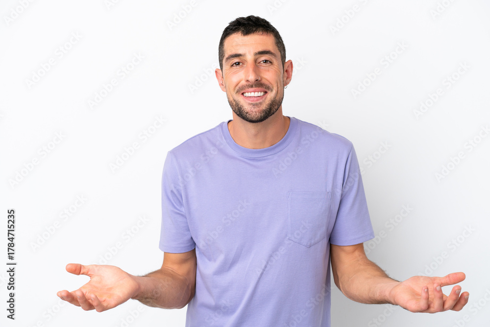 Fototapeta premium Young handsome caucasian man isolated on white background happy and smiling