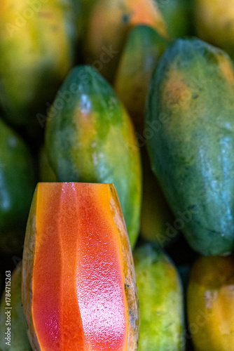 Background image of a beautiful red ripe papaya for use in cooking.