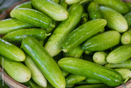 .Background image of organic cucumbers prepared for cooking.