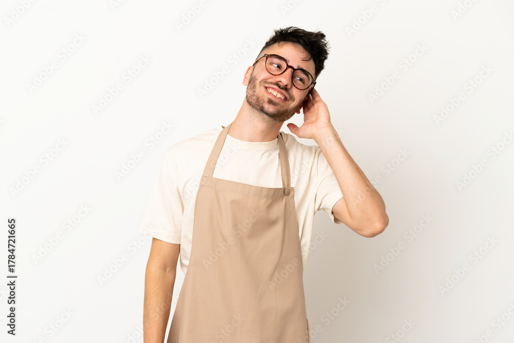 Fototapeta premium Restaurant waiter caucasian man isolated on white background thinking an idea