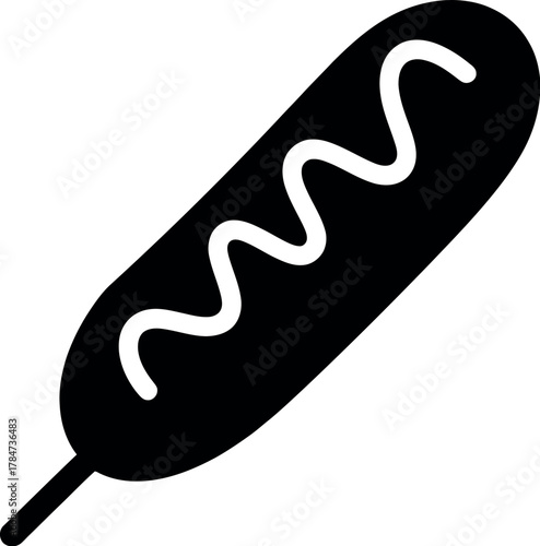 Black corn dog with white squiggle food