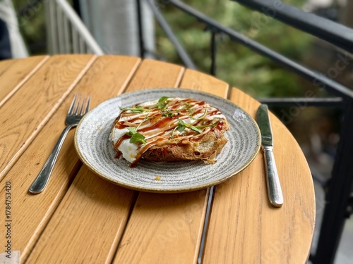 Hiroshima style okonomiyaki with fried  eggs for breakfast