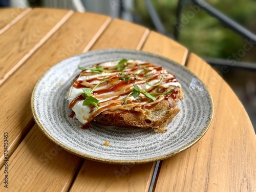 Hiroshima style okonomiyaki with fried  eggs for breakfast