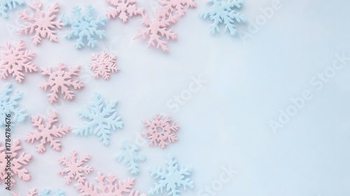 Light pink and icy blue snowflakes on pale background, subtle winter decoration