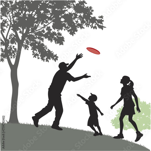 Family playing frisbee in the park on a sunny day