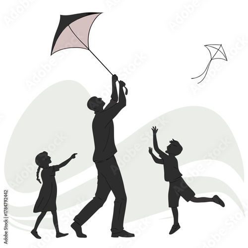 Father and children flying kites on a windy day