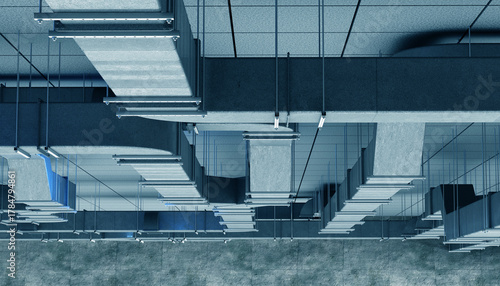 Ventilation installation work in an industrial building. Engineers assemble metal air ducts for modern HVAC systems to ensure efficient airflow and climate control.