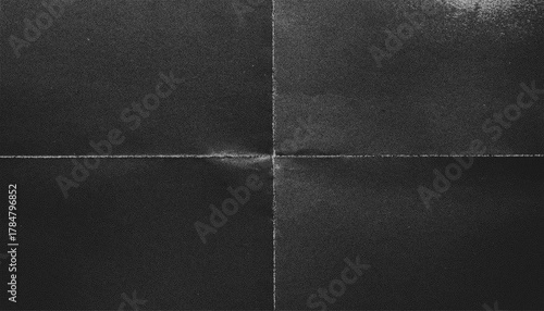 The texture of crumpled monochrome paper with the effect of noise, creases and unevenness.