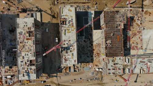 Industrial construction site with houses equipment and materials