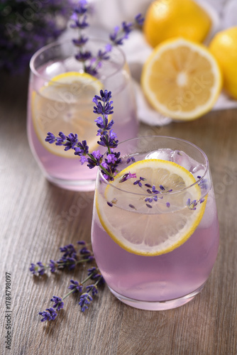 Summer homemade lemonade with lavender syrup, lemon juice and sparkling water with lavender sprigs