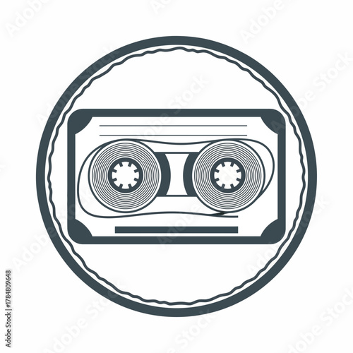 Illustration of a cassette tape with circular reels inside a decorative circular border design element