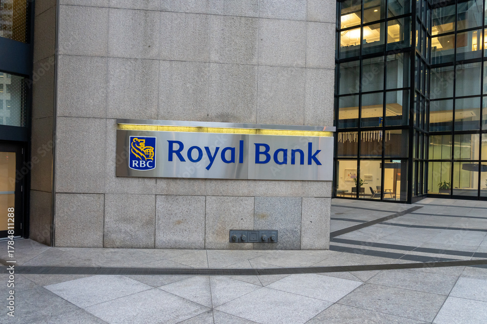 Fototapeta premium Toronto, Ontario, Canada - October 8, 2025: Royal Bank sign at the entrance to RBC (Royal Bank of Canada) corporate headquarters in the financial district, Toronto, Ontario, Canada. 