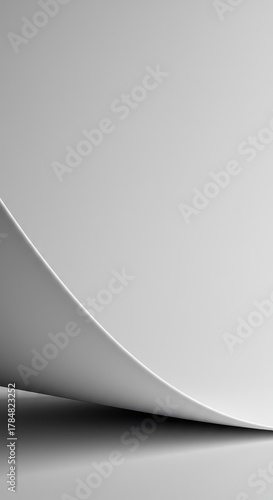 Abstract minimalist design featuring a smooth white surface curving gently into an infinite blank background, emphasizing form ,design ,geometry ,void