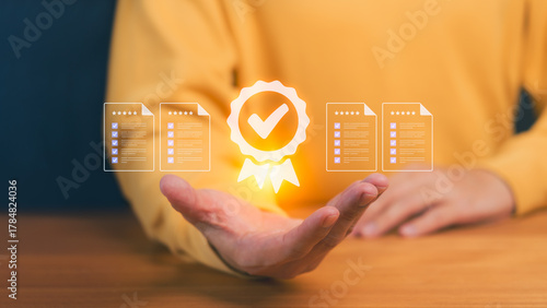Person hand showing a digital icons of certificates, checklists, and a quality badge. Symbolizing certification, testimonial, compliance, digital credentials, and professional standards verification.