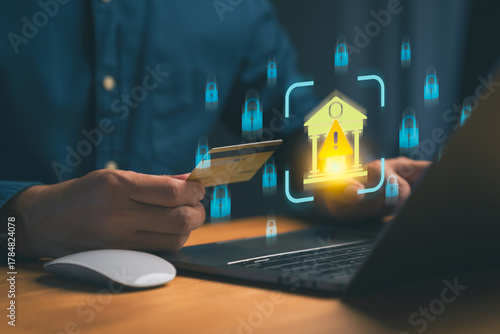 Online banking security risk concept showing person holding credit card and laptop with cybersecurity alert icon, symbolizing financial fraud, data protection, and secure internet transactions.