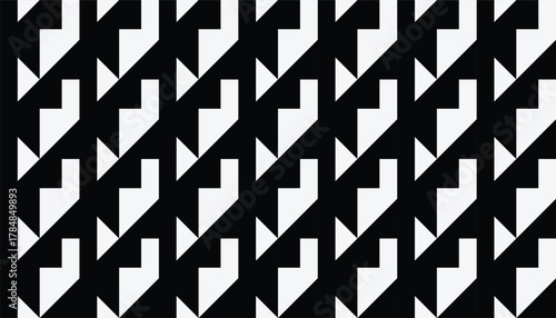 A seamless black-and-white geometric pattern featuring repeated angular arrow-like shapes arranged in a diagonal layout. The sharp contrast between the black background and white forms