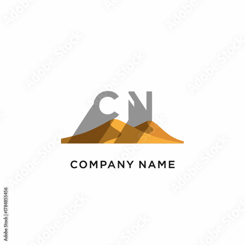Abstract CN letter logo design on desert landscape.