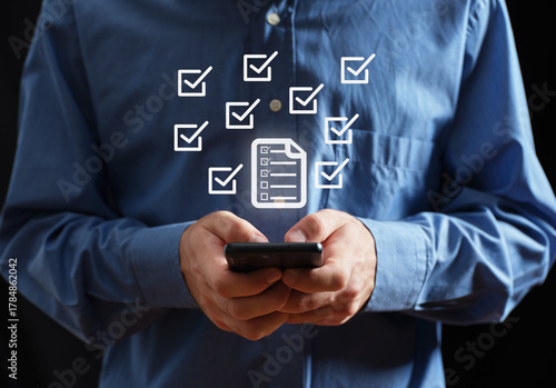 Man checking digital checklist on smartphone application