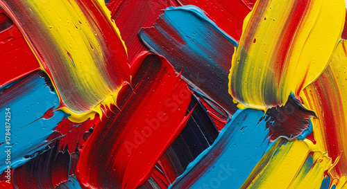 Vibrant abstract paint strokes in red yellow and blue