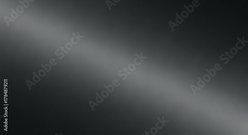 Dark gray brushed metal texture with diagonal light reflection