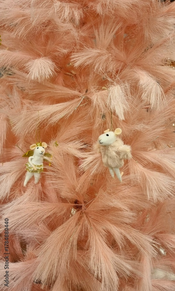 Naklejka premium winter pink Christmas tree with toy mice in pink, Christmas concept, decor and home celebration, shopping, Christmas interior, winter card