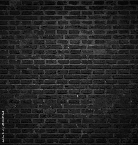 Textura o fondo de pared de ladrillo negro rugoso