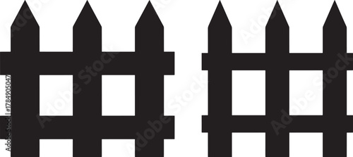 Black silhouette of two wooden picket fences