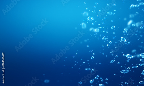 Deep blue ocean water background with light and bubbles creates a serene underwater winter sea texture pattern