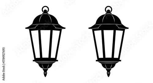 two elegant vintage lanterns hanging side by side