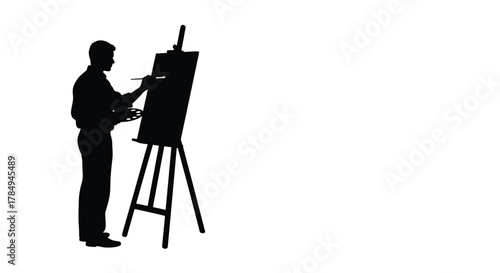 an artist painting on canvas using an easel in silhouette