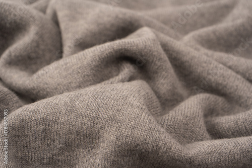 Soft grey merino wool sweater texture as a background.