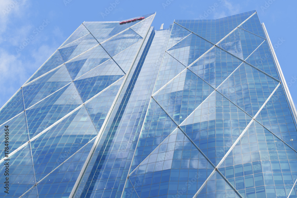 Obraz premium abstract oblique angle skyward view of CIBC Square, designed by WilkinsonEyre and Adamson Associates Architects, located at 81 and 141 Bay St, Toronto